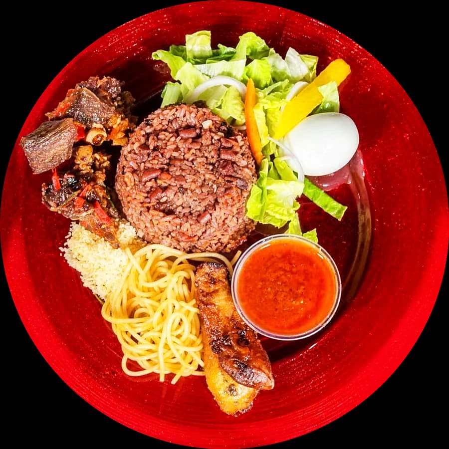 Loaded waakye with shito, gari, spaghetti and egg, from above