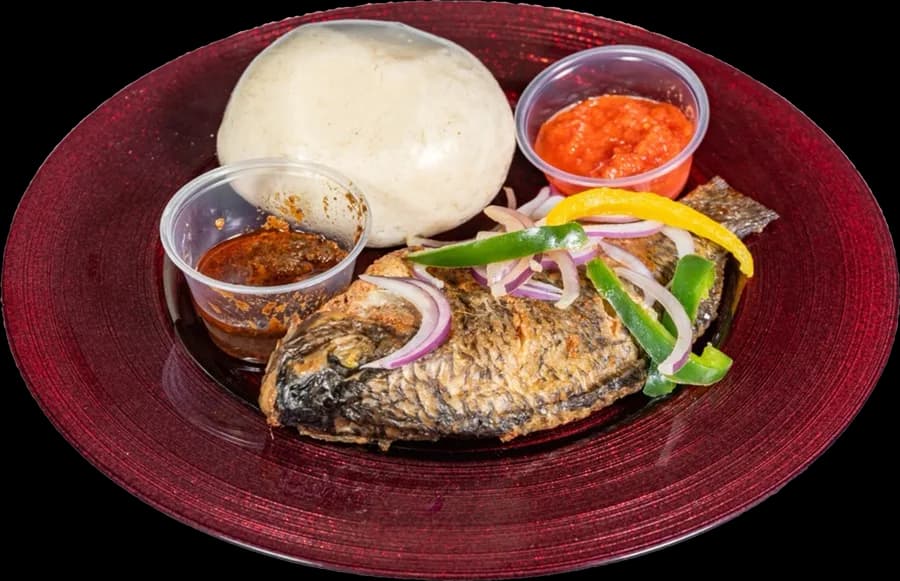 Banku with grilled tilapia, pepper and shito