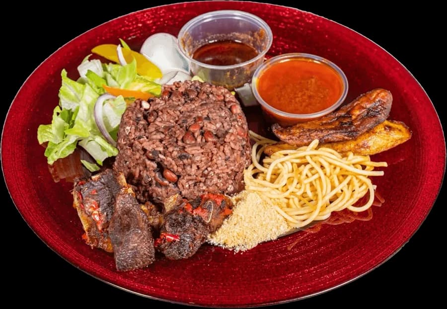 Loaded waakye with shito, gari, spaghetti, plantain and egg